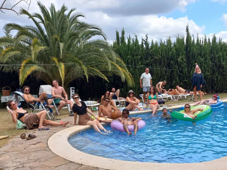 People on holiday enjoying sunshine and the swimming pool